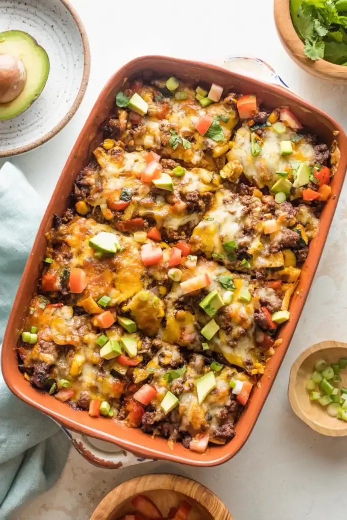 Ground beef enchilada casserole in a baking dish.