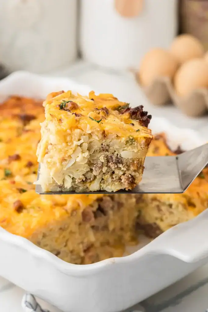 Close-up of hashbrown breakfast casserole on a spatula.