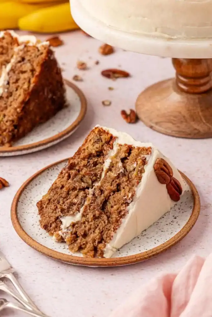 Slice of hummingbird cake on a plate.