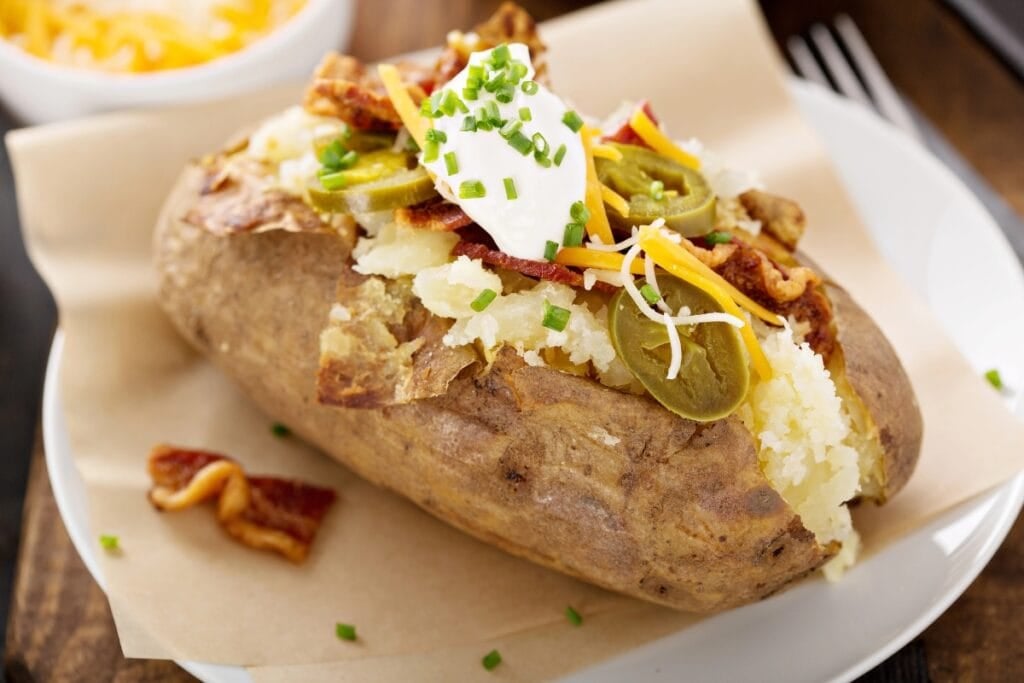 Loaded baked potato on a plate.
