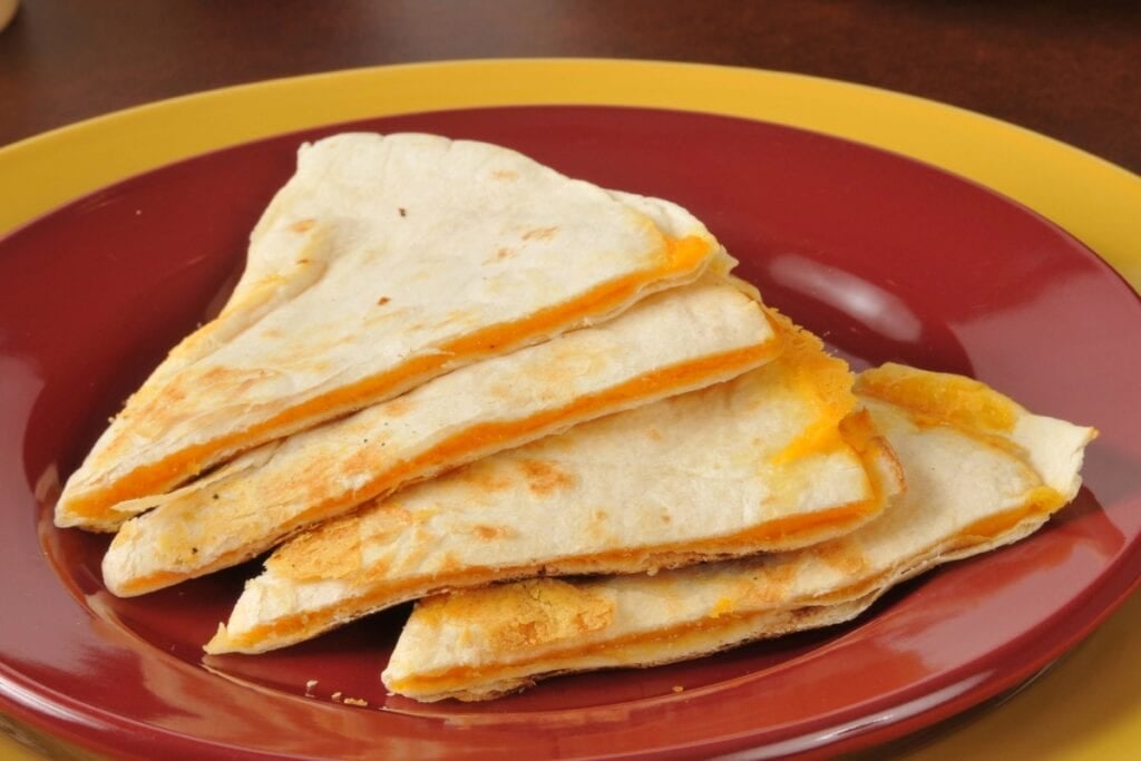 Microwaved quesadilla on a plate.