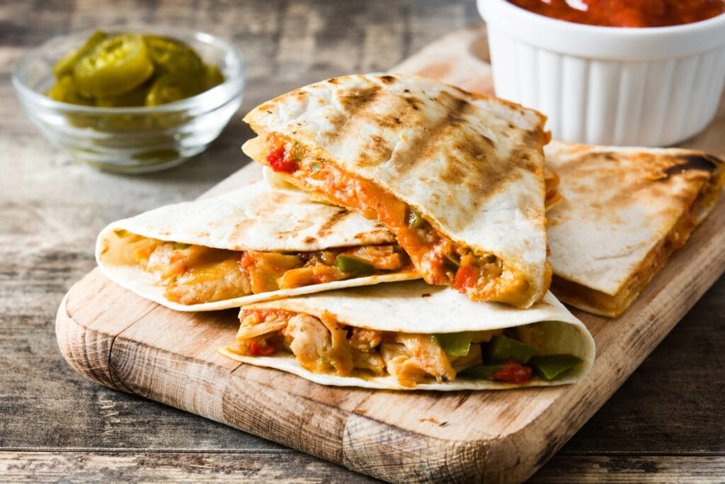 Quesadillas on a wooden board.