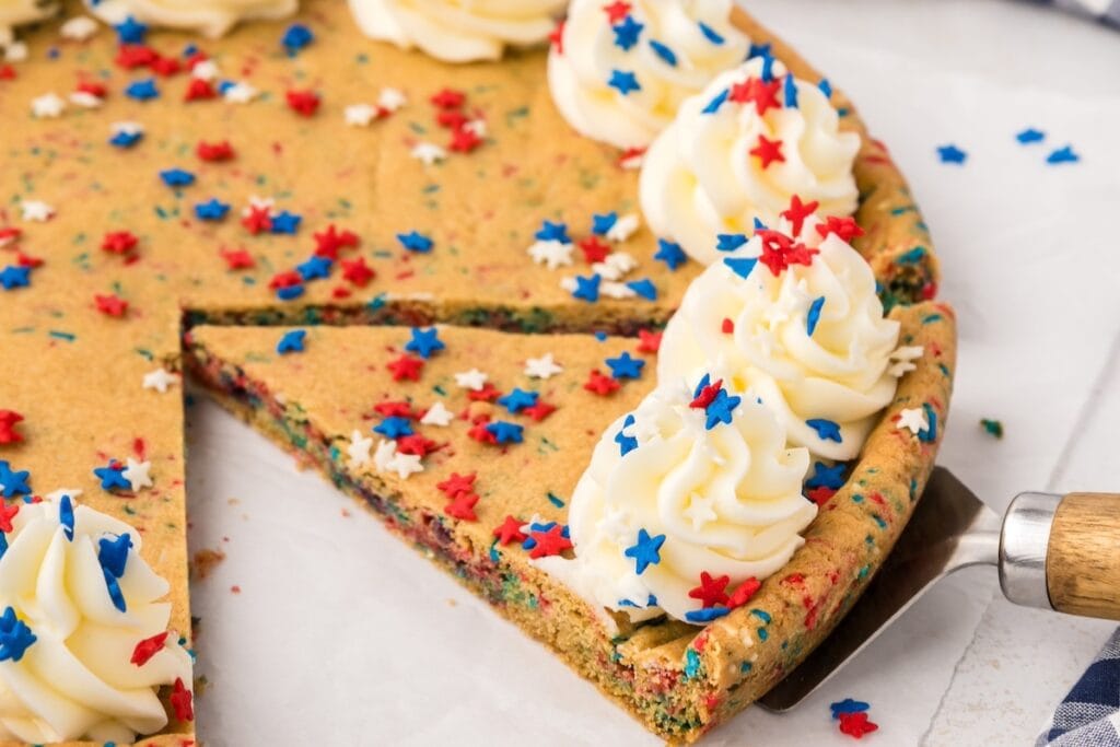 Cookie cake with frosting and sprinkles.