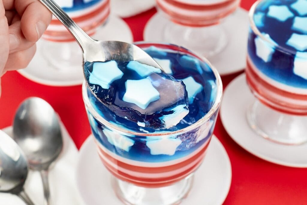 Red white and blue jello cups with star toppings.