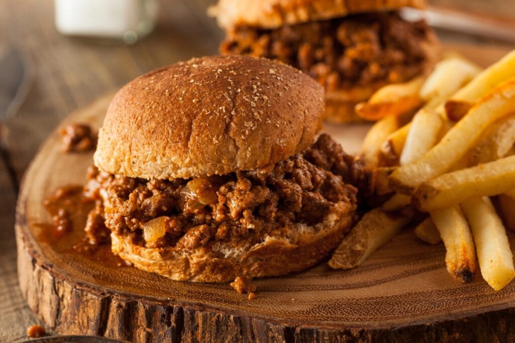 Sloppy joes on a wooden board.