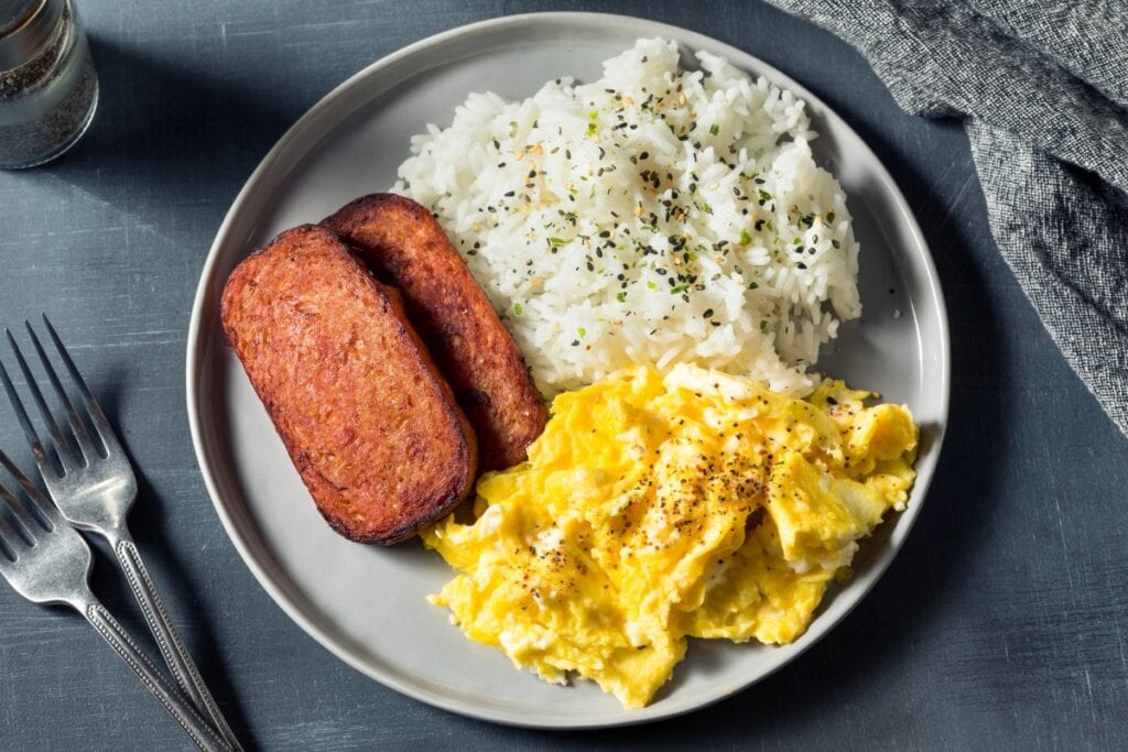 Spam and eggs with rice on a plate.