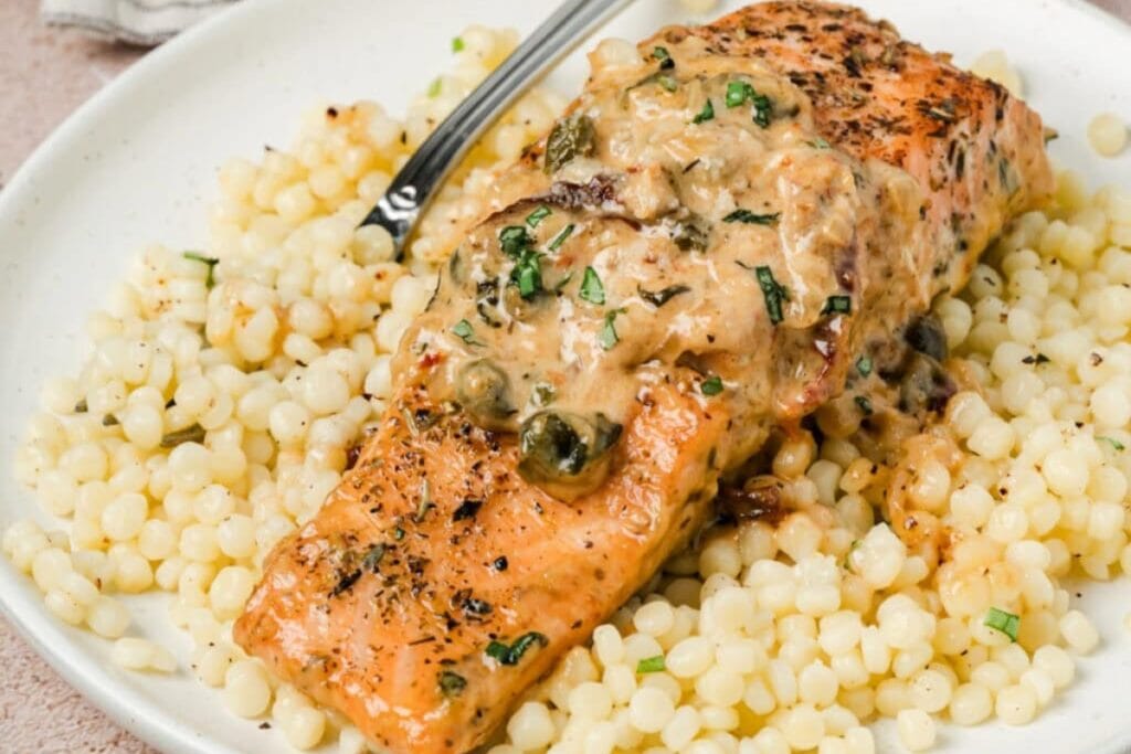 Tuscan salmon on a plate.