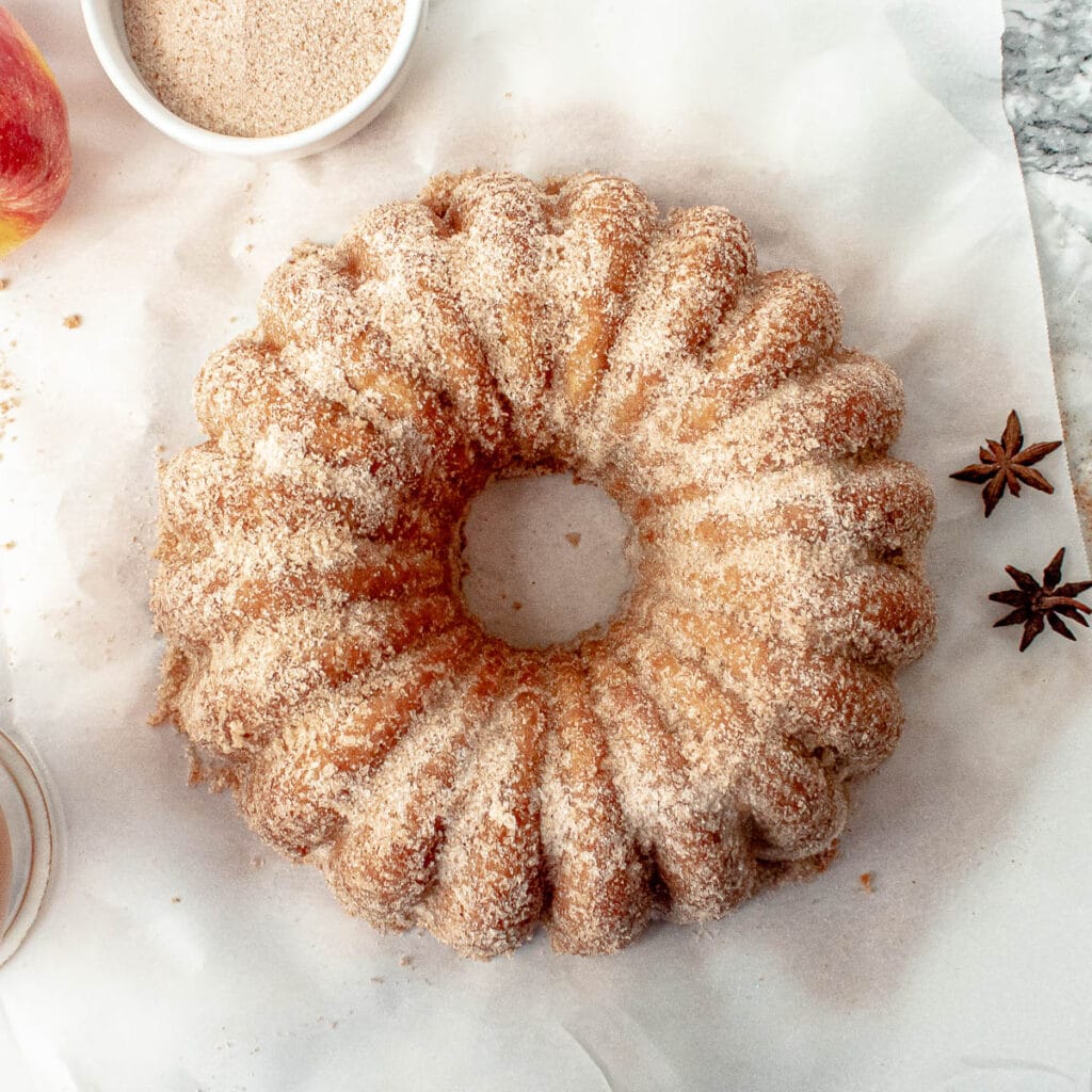 Apple cider bundt cake on a parchment paper.