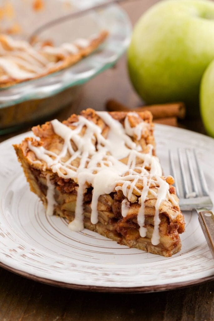 Cinnamon roll apple pie on a plate.