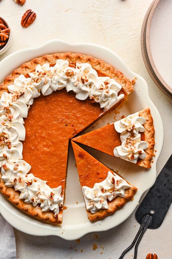 Sweet potato pie on a white plate.
