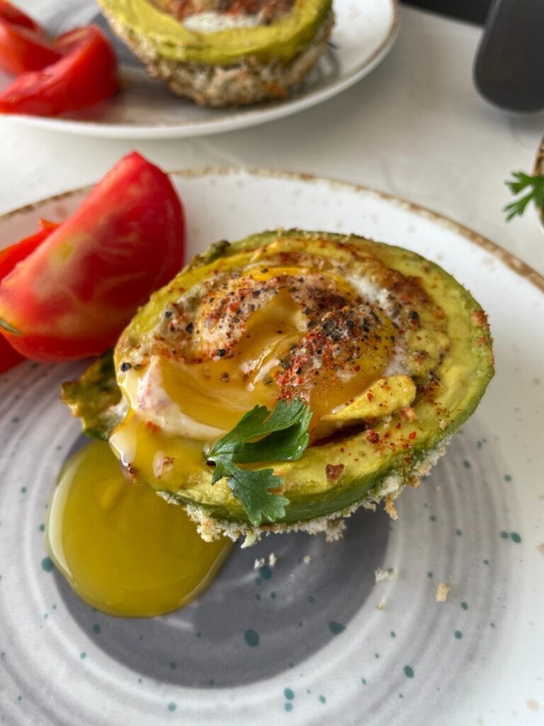 Air Fryer Avocado Egg Boats served on a plate.