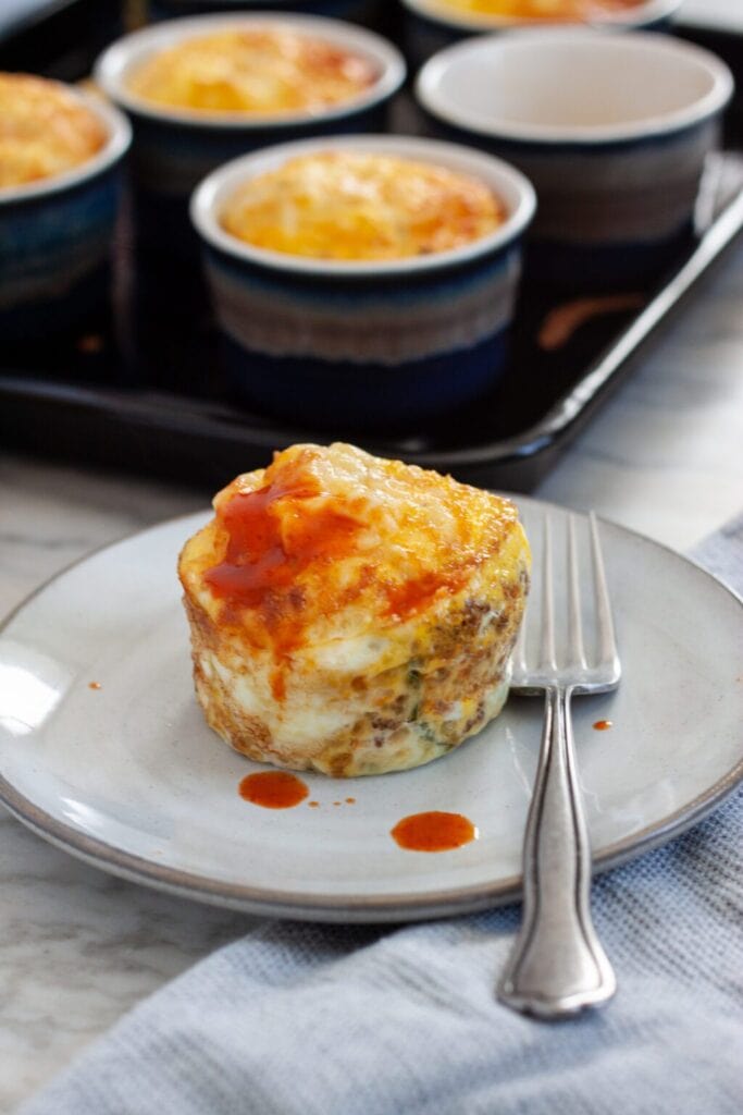 Air Fryer Egg Muffins served on a plate with a fork.