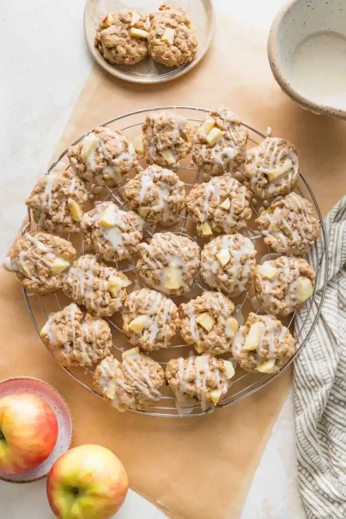 Apple cinnamon oatmeal cookies on a cooling rack.