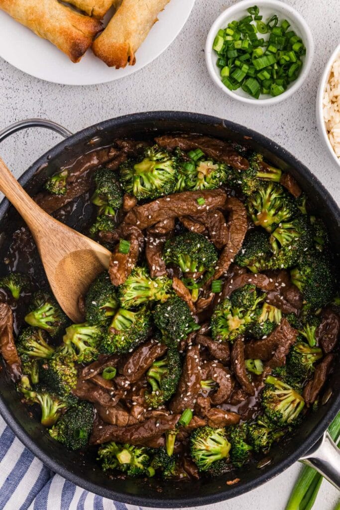 Beef and broccoli in a skillet.