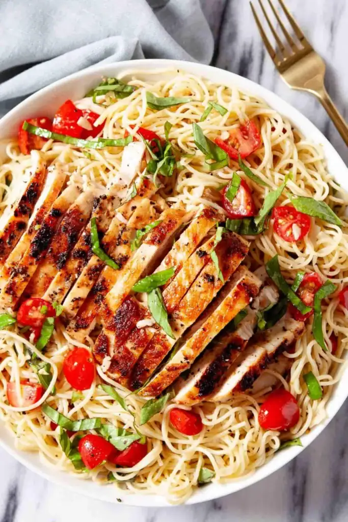 Bruschetta chicken pasta on a plate.