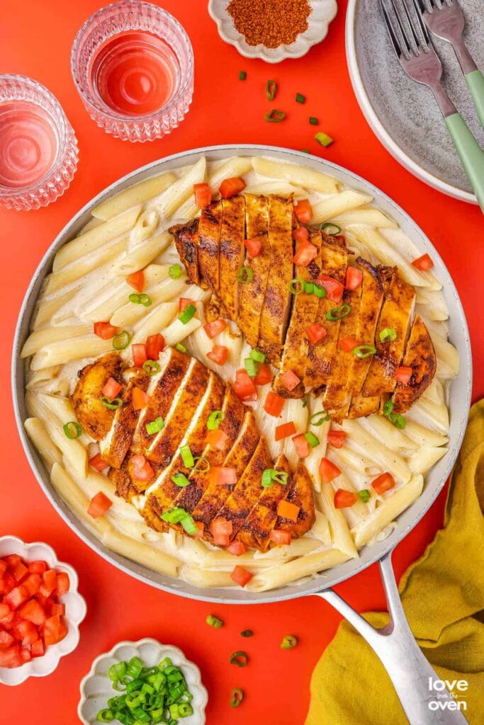 Cajun chicken pasta in a skillet.