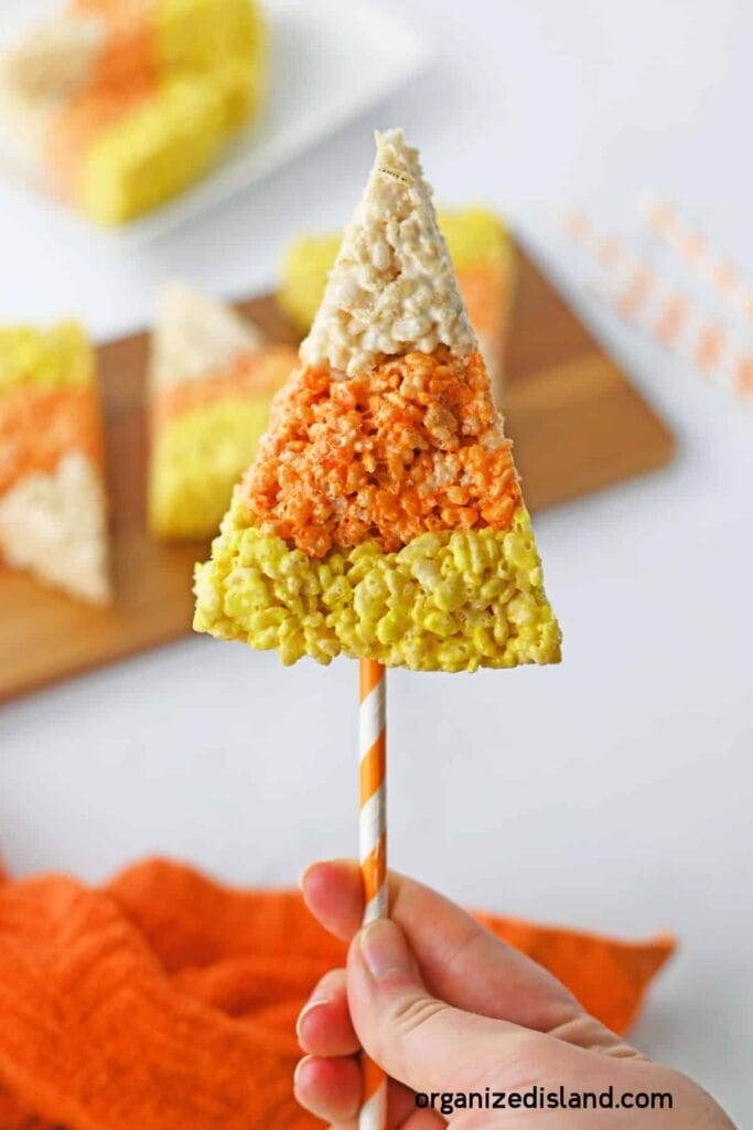 Candy corn Rice Krispie treats on a stick.