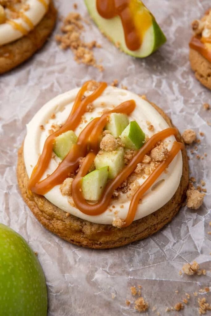 Caramel apple cookies on parchment paper.
