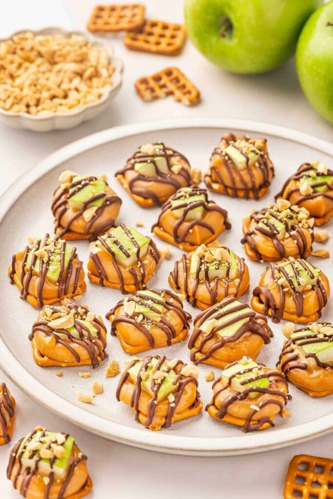 Caramel apple pretzel bites on a plate.