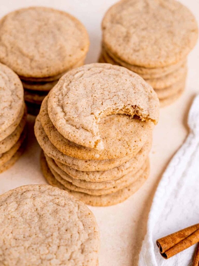 Stack of chai sugar cookies on parchment paper.
