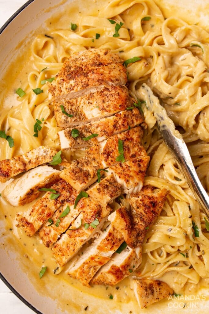 Chicken Alfredo in a skillet.