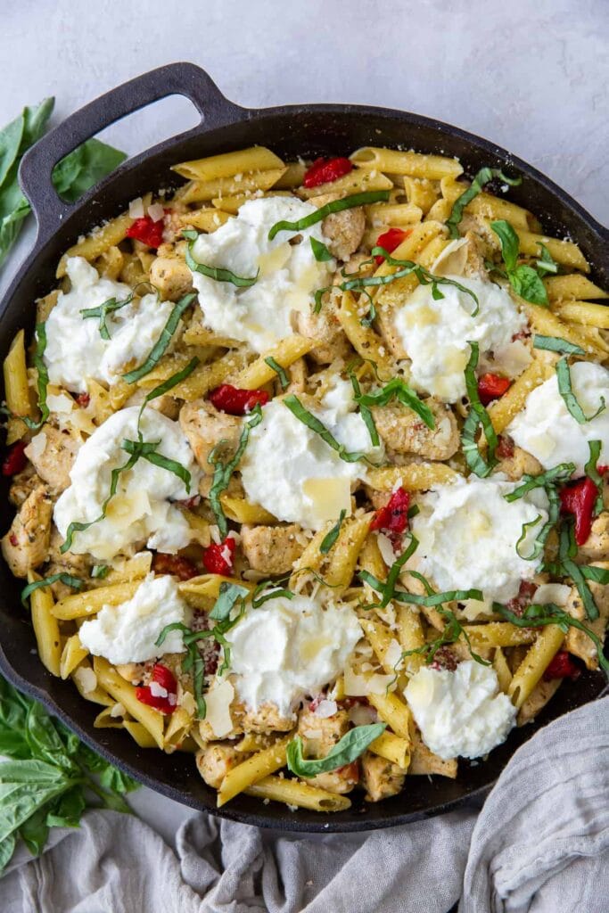 Chicken pesto pasta in a skillet.