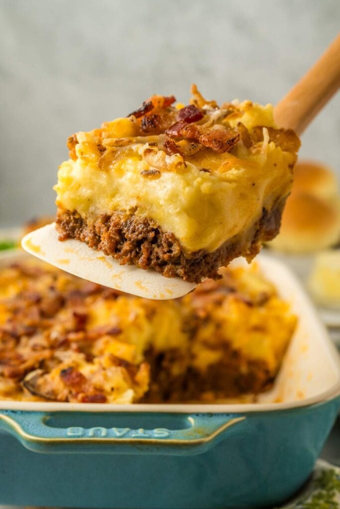 Close-up of cowboy meatloaf and potato casserole on a spatula.