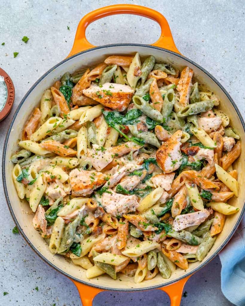 Creamy salmon pasta in a pot.