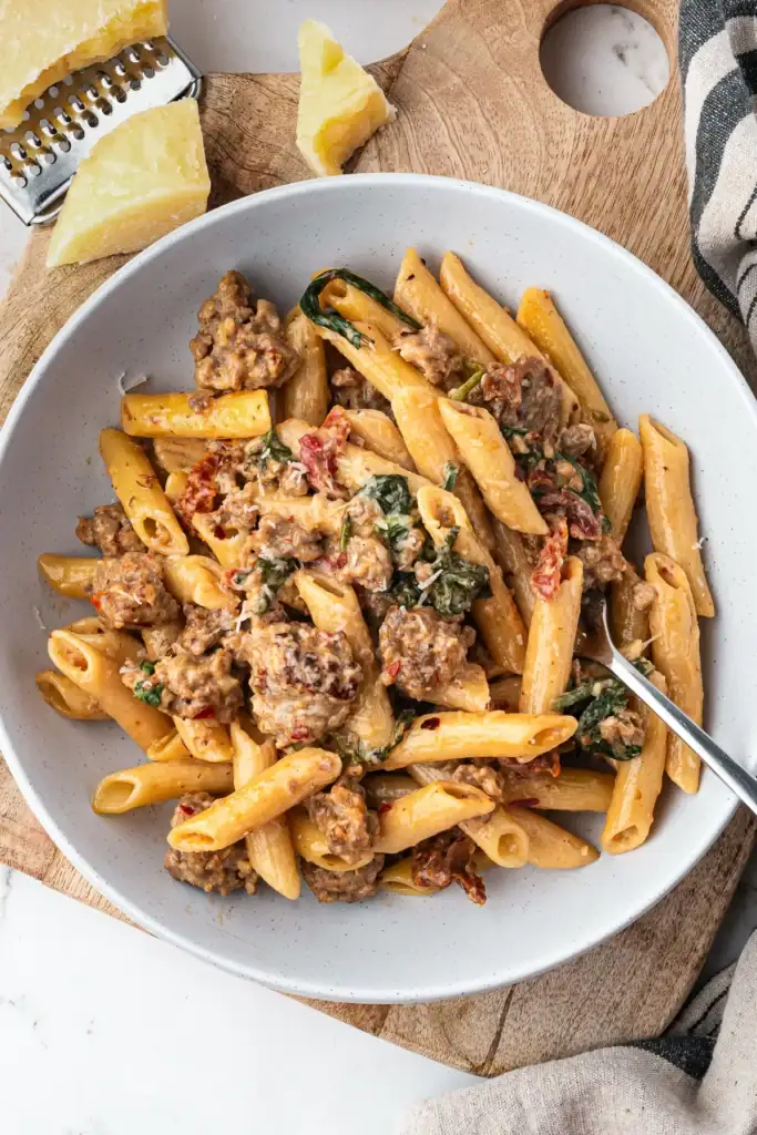 Creamy sausage pasta in a bowl.