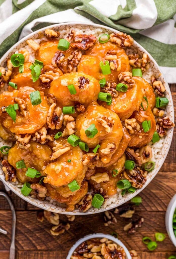 Honey walnut shrimp in a bowl with rice.