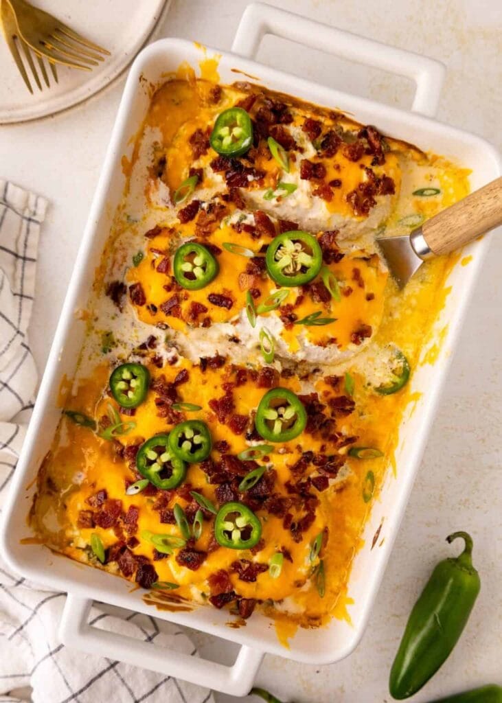 Overhead view of jalapeño popper chicken in a baking dish.