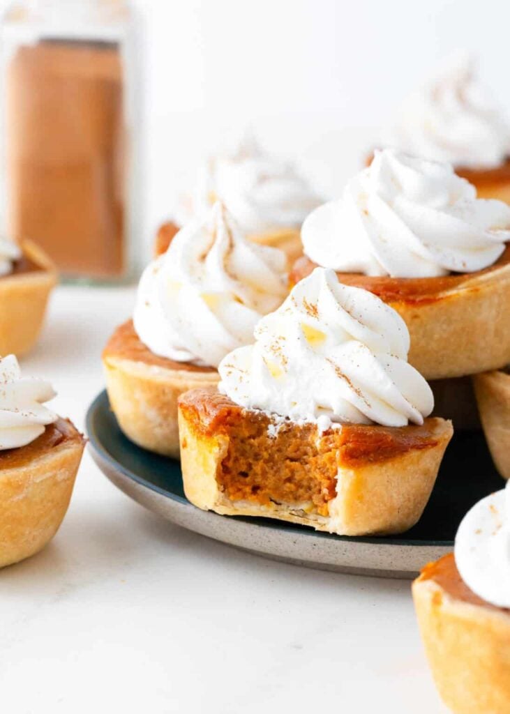 Mini pumpkin pies on a plate.