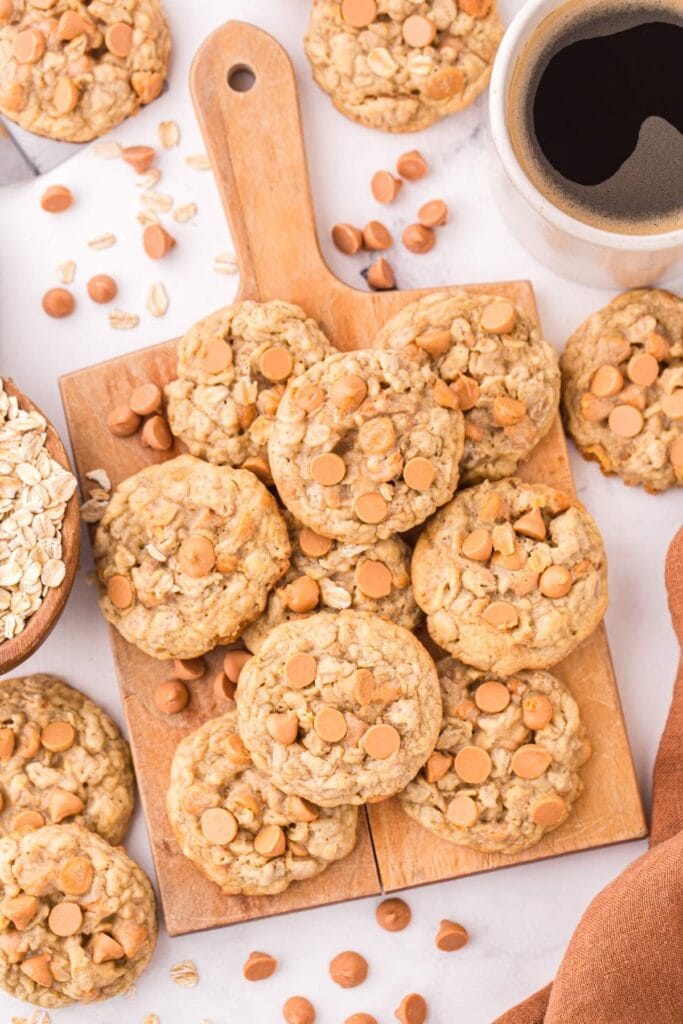 Oatmeal butterscotch cookies on a wooden board.