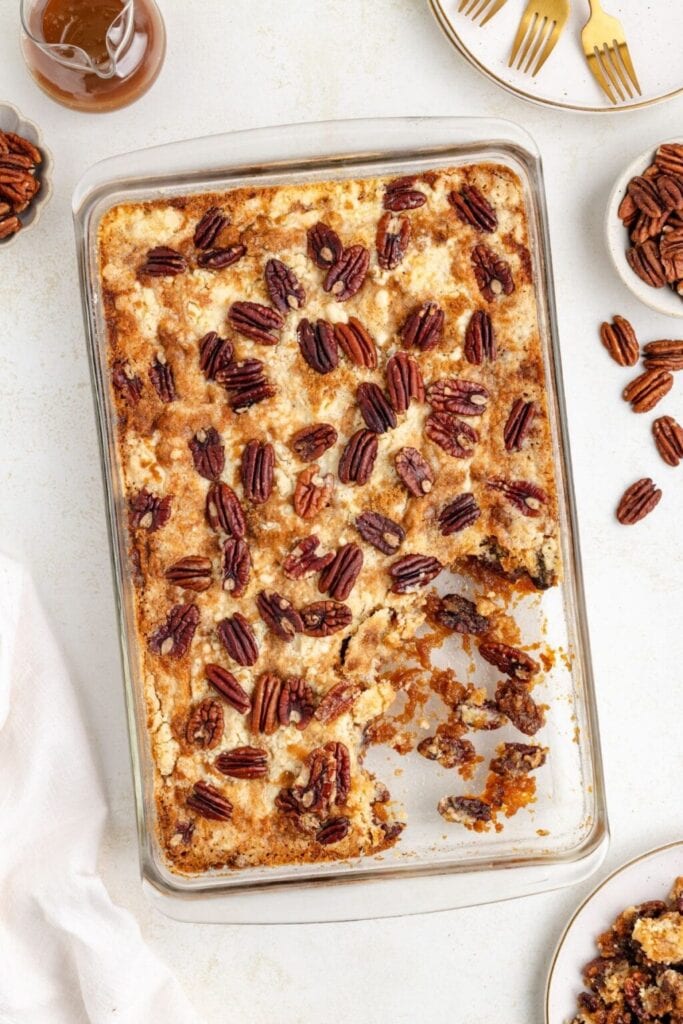 Pecan pie dump cake in a baking dish.