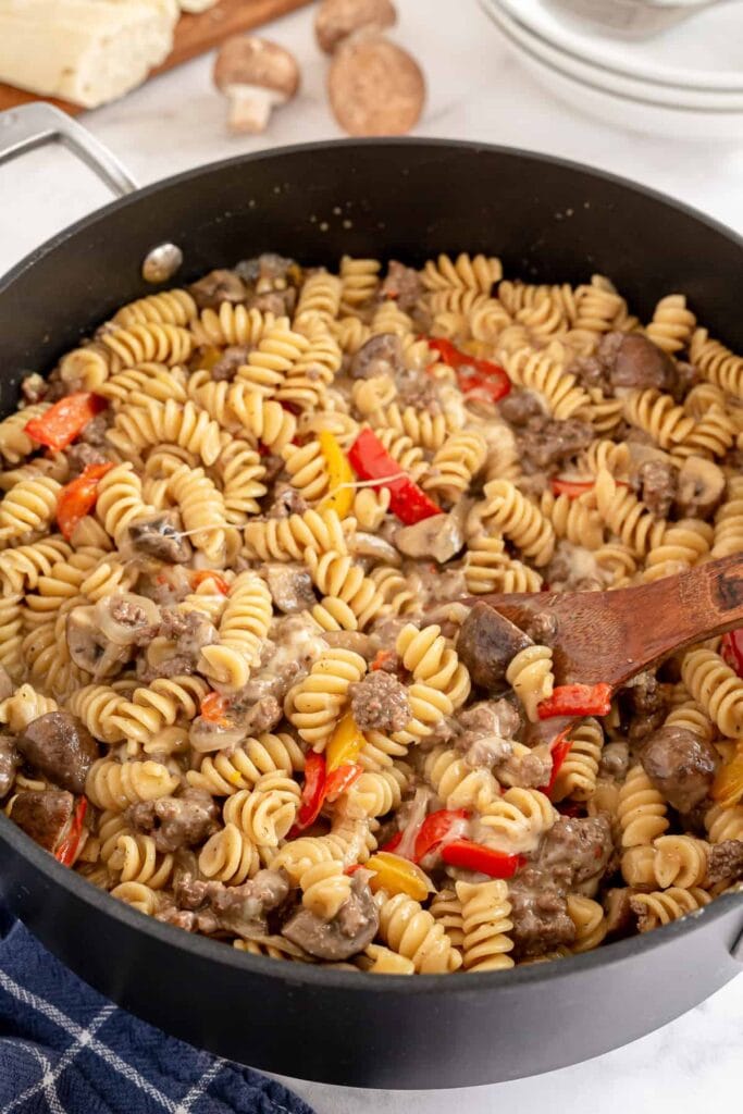 Philly cheesesteak pasta in a pot.
