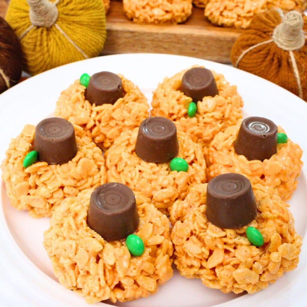 Pumpkin Rice Krispie treats on a plate.