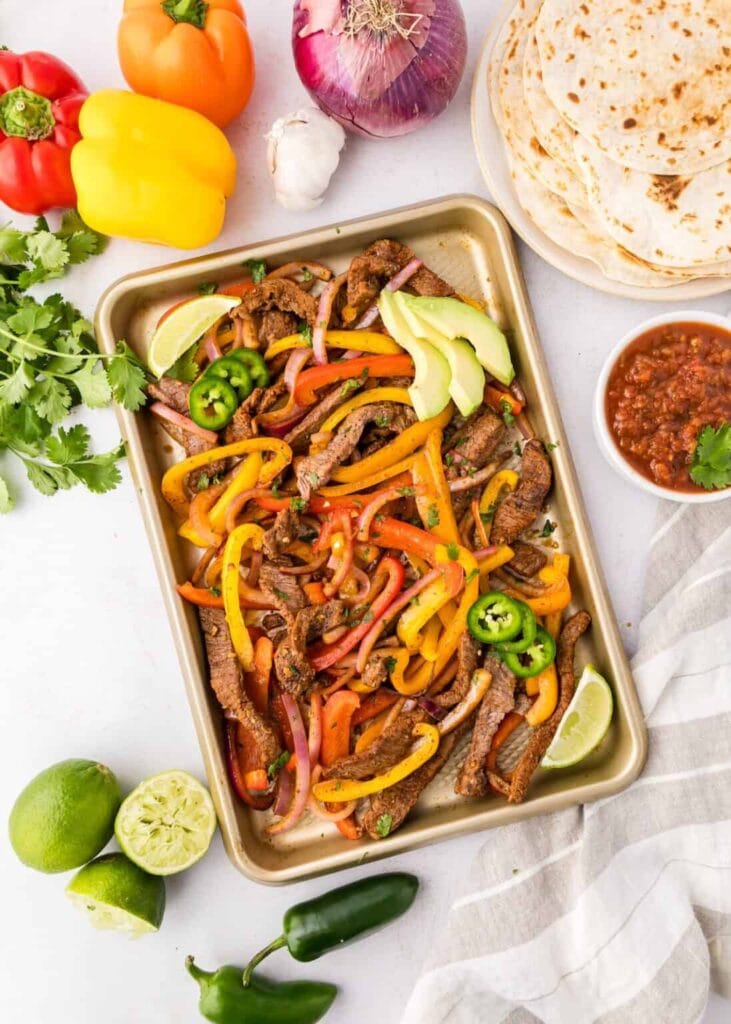 Overhead view of sheet pan steak fajitas.