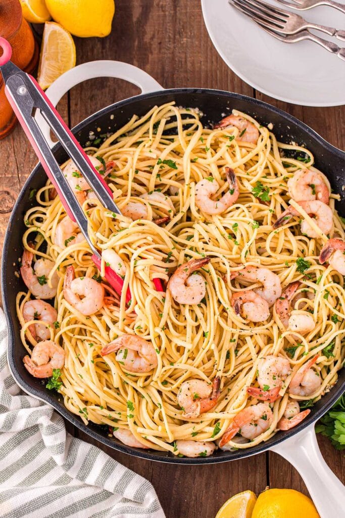 Shrimp linguine pasta in a skillet.