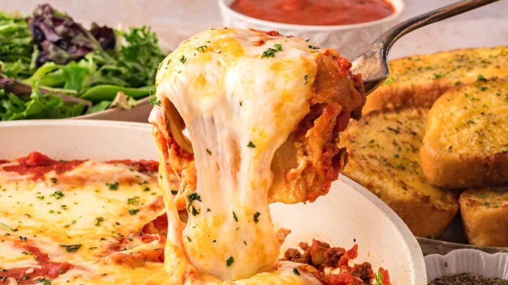 Close-up of skillet lasagna on a spoon.