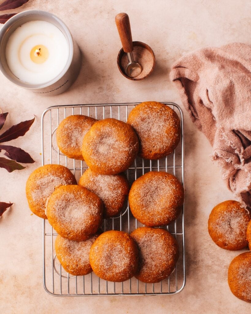 Soft pumpkin cookies on a cooling rack.