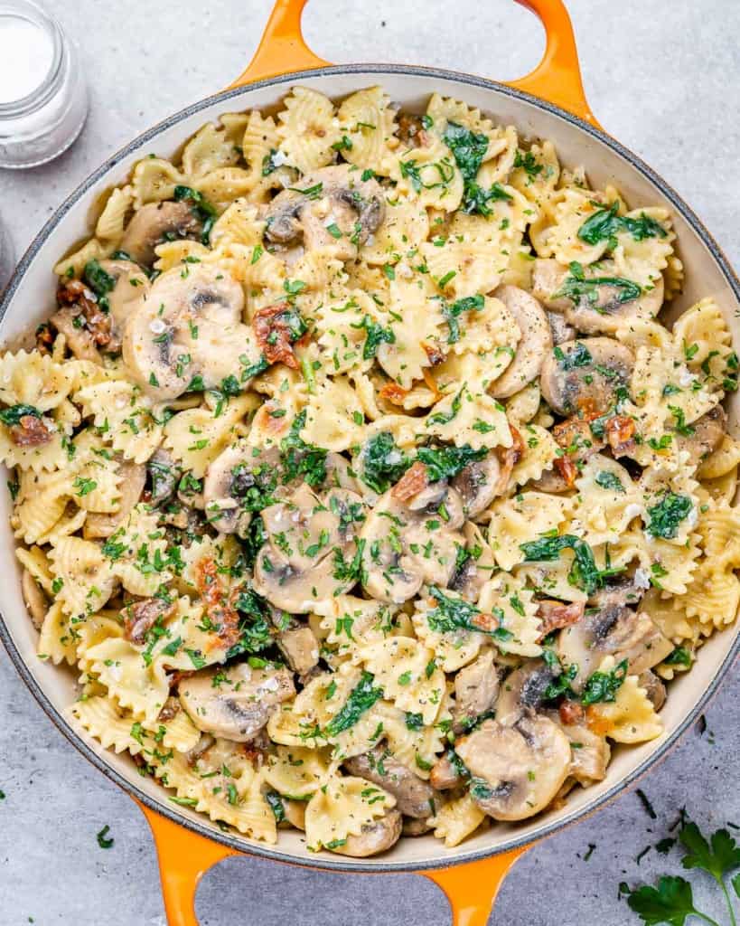 Spinach and mushroom pasta in a pot.