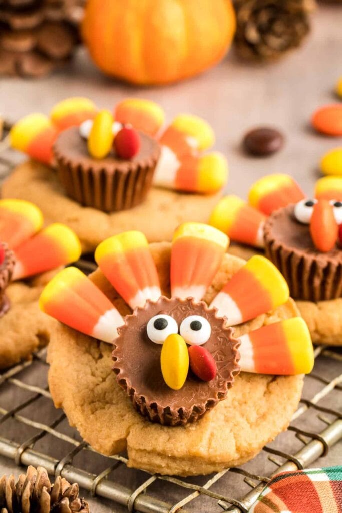 Thanksgiving turkey cookies on a cooling rack.
