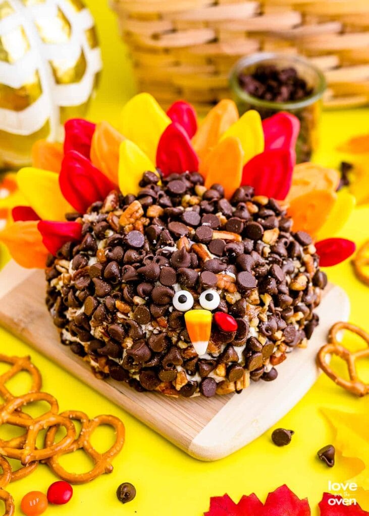 Turkey cheese ball on a wooden board.