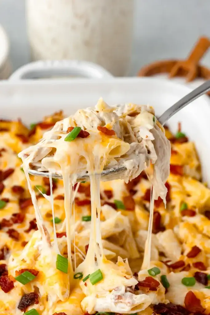 Close-up of chicken bacon ranch casserole on a spoon.