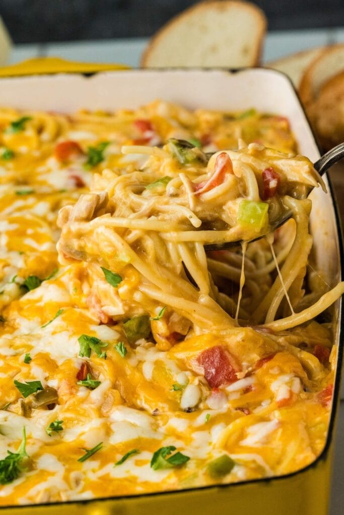 Chicken spaghetti casserole in a baking dish.