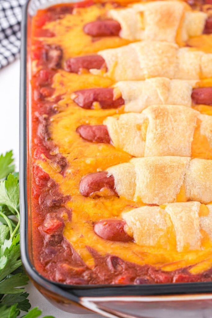 Chili cheese dog casserole in a baking dish.