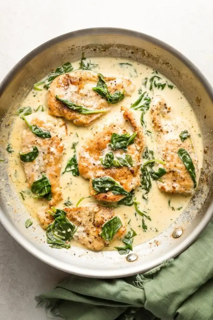 Creamy chicken Florentine in a skillet.