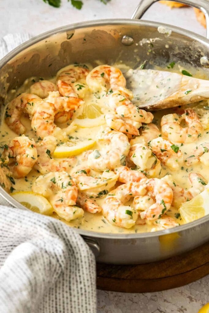 Creamy lemon garlic prawns in a pot.