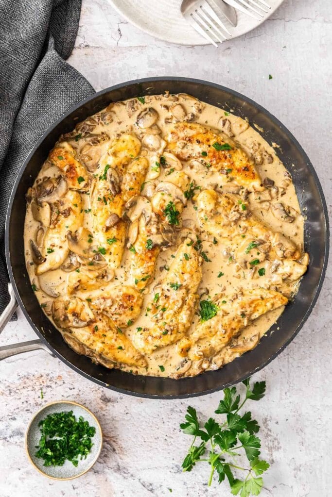 Creamy mushroom chicken in a skillet.