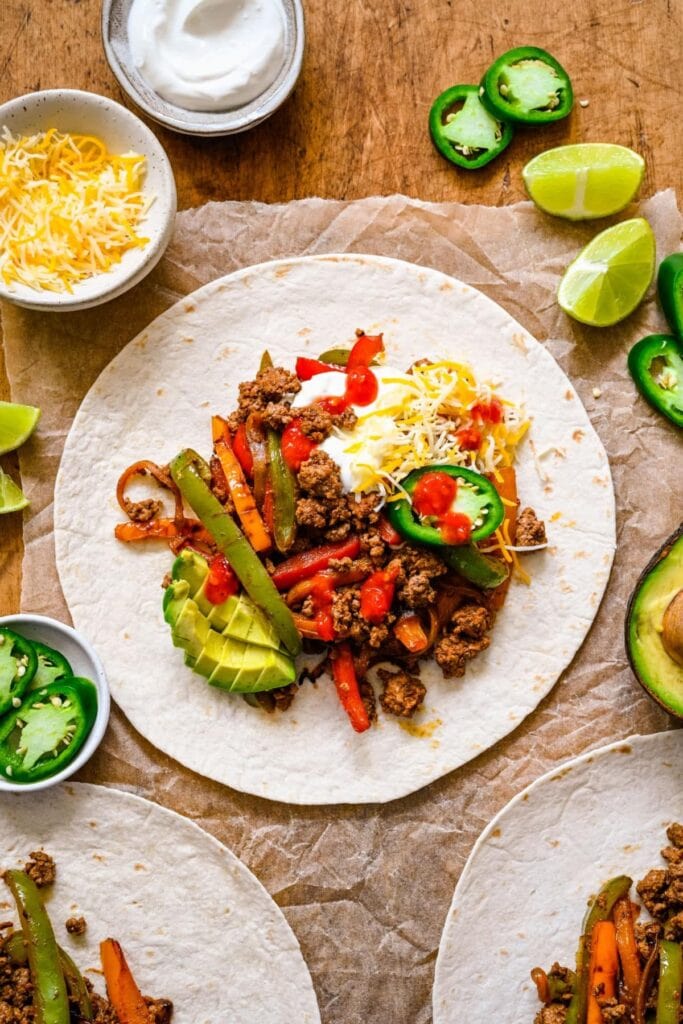Ground beef fajitas on parchment paper.